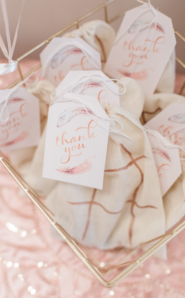 Thank you tags with feather design on party favour bags