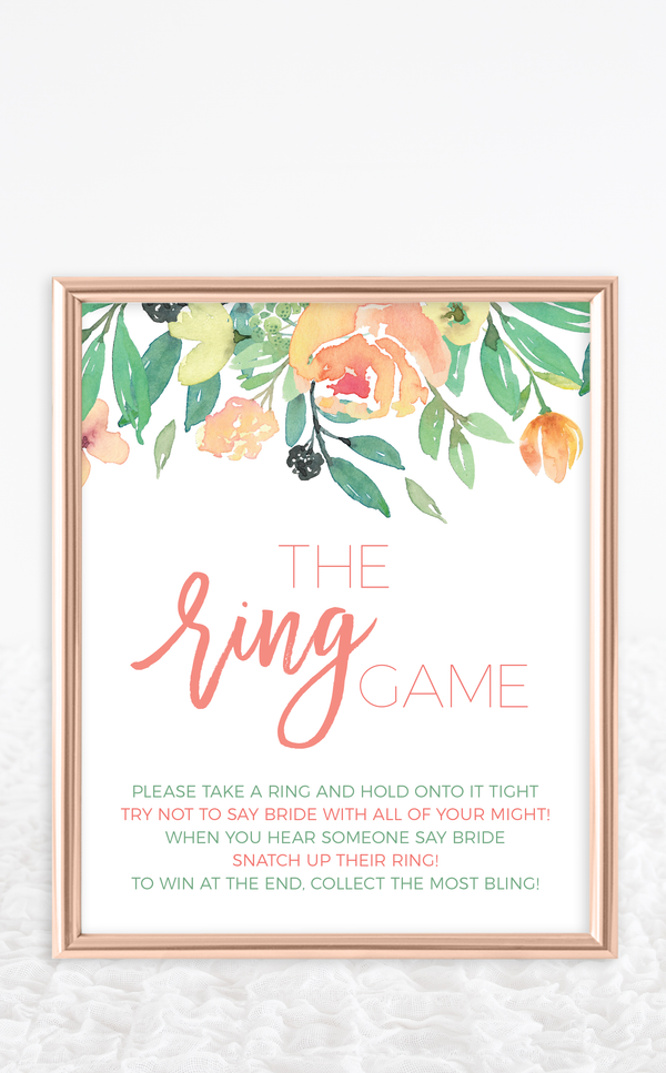 The ring game bridal shower sign with coral floral and greenery design