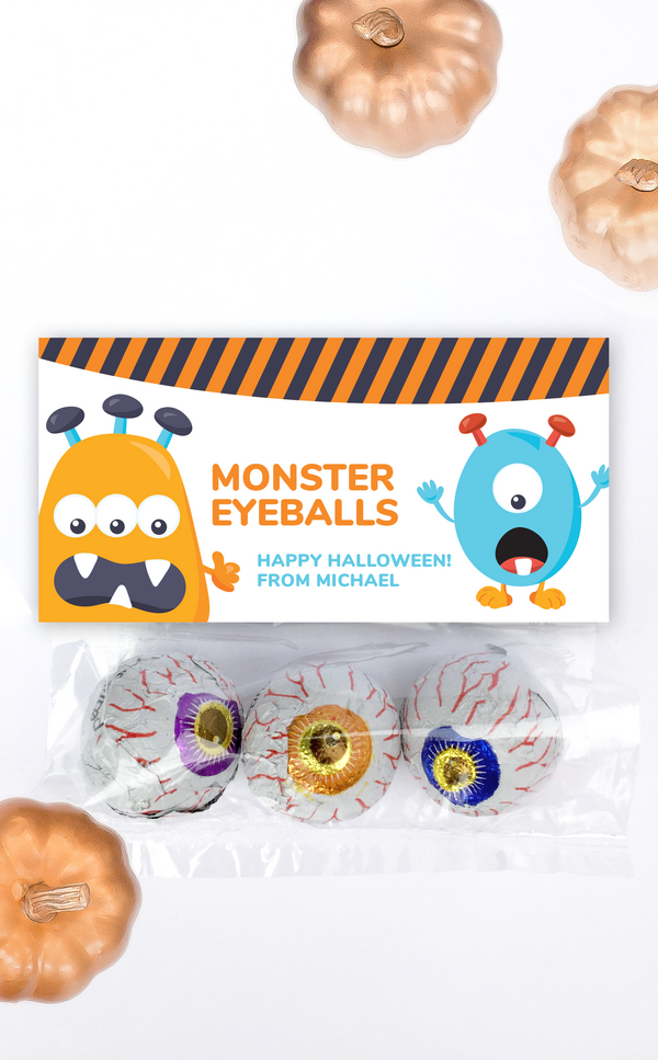 Monster treat bag topper for party favors filled with chocolate eyeballs
