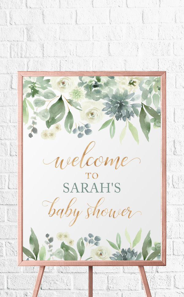 Baby shower welcome sign with succulents, flowers and greenery framed on an easel